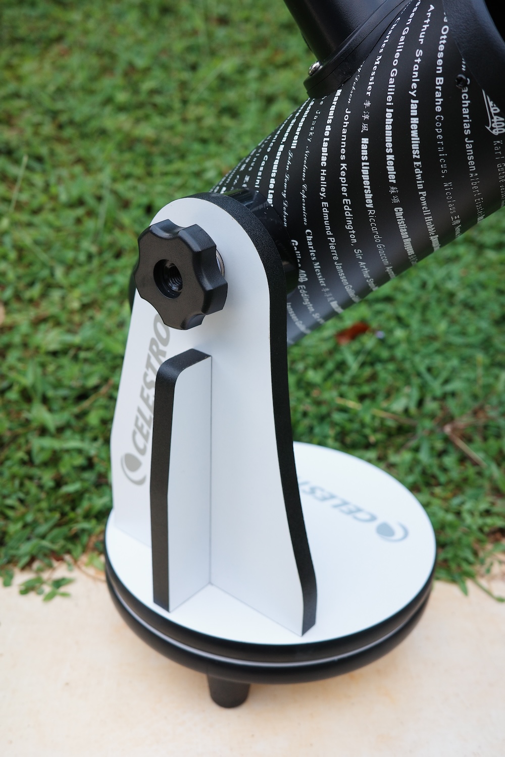Hand knob for altitude tension adjustment on one side of the dobsonian mount